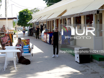 A generator is powering a cafe at the seaside during rolling blackouts in Odesa, Ukraine, on June 11, 2024. NO USE RUSSIA. NO USE BELARUS. (