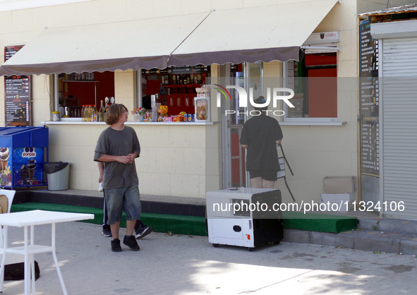 A generator is powering a cafe at the seaside during rolling blackouts in Odesa, Ukraine, on June 11, 2024. NO USE RUSSIA. NO USE BELARUS. 