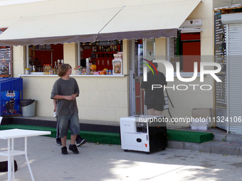 A generator is powering a cafe at the seaside during rolling blackouts in Odesa, Ukraine, on June 11, 2024. NO USE RUSSIA. NO USE BELARUS. (