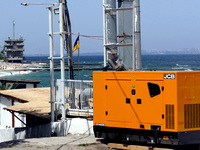 A generator is powering a cafe at the seaside during rolling blackouts in Odesa, Ukraine, on June 11, 2024. NO USE RUSSIA. NO USE BELARUS. (