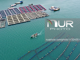 Workers are working in a breeding area at a marine ranch in Lianjiang County, Fuzhou, in Fuzhou, China, on June 11, 2024. (