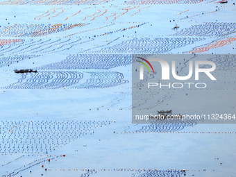 Workers are working in a breeding area at a marine ranch in Lianjiang County, Fuzhou, in Fuzhou, China, on June 11, 2024. (