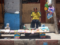 A displaced girl is selling toys and waiting for customers on a street next to Al-Aqsa Martyrs Hospital in Deir el-Balah, in the central Gaz...