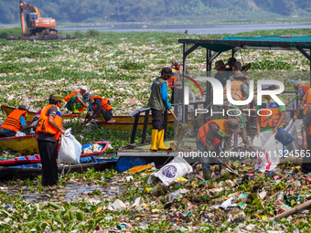 Joint officers are cleaning up plastic waste from the heavily polluted Citarum River in Batujajar, Bandung, West Java, Indonesia, on June 12...