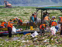 Joint officers are cleaning up plastic waste from the heavily polluted Citarum River in Batujajar, Bandung, West Java, Indonesia, on June 12...