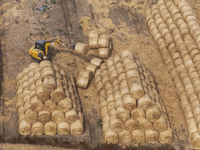 Farmers are recycling wheat straw in a field at Dahuangzhuang village in Huai'an city, East China's Jiangsu province, on June 12, 2024. (