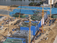 Workers are working on the construction of the second phase of the Huaihe River estuary waterway project in the second river hub section in...