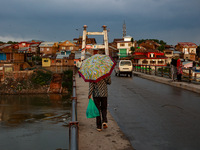 A man is walking as he is holding an umbrella after light rainfall in Sopore, Jammu and Kashmir, India, on June 12, 2024 (