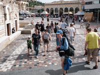 Tourists are walking at Monastiraki Square during a heatwave in Athens, Greece, on June 12, 2024. Many of the country's schools are remainin...