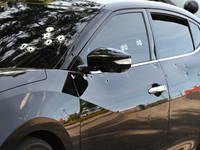 A vehicle is being damaged by bullet holes in the KFC parking lot. Three people are being shot in Chicago, Illinois, United States, on June...