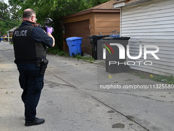 Chicago police are taking pictures of the crime scene. A 17-year-old male victim is shot multiple times and is in critical condition in Chic...