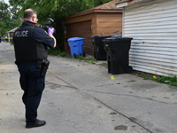 Chicago police are taking pictures of the crime scene. A 17-year-old male victim is shot multiple times and is in critical condition in Chic...