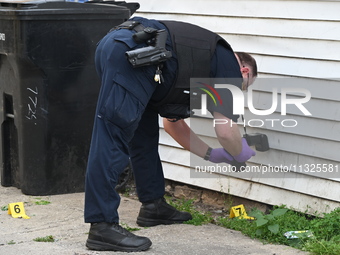 Chicago police are taking pictures of the crime scene. A 17-year-old male victim is shot multiple times and is in critical condition in Chic...