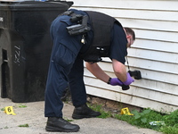 Chicago police are taking pictures of the crime scene. A 17-year-old male victim is shot multiple times and is in critical condition in Chic...