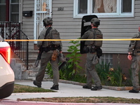 The Chicago Police SWAT Team is arriving at residences to search for suspects involved in the shooting of a 67-year-old male food vendor in...