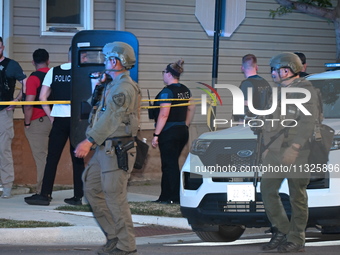 The Chicago Police SWAT Team is arriving at residences to search for suspects involved in the shooting of a 67-year-old male food vendor in...