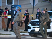 The Chicago Police SWAT Team is arriving at residences to search for suspects involved in the shooting of a 67-year-old male food vendor in...