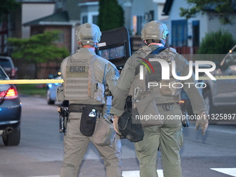 The Chicago Police SWAT Team is arriving at residences to search for suspects involved in the shooting of a 67-year-old male food vendor in...