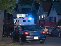 The Chicago Police SWAT Team is arriving at residences to search for suspects involved in the shooting of a 67-year-old male food vendor in...