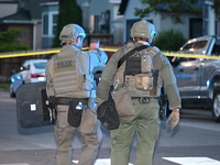 The Chicago Police SWAT Team is arriving at residences to search for suspects involved in the shooting of a 67-year-old male food vendor in...