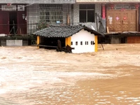 The flood damage is occurring in Gaozhai village, Qiandongnan County, Guizhou province, China, on the morning of June 12, 2024. (