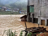 The flood damage is occurring in Gaozhai village, Qiandongnan County, Guizhou province, China, on the morning of June 12, 2024. (