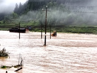 The flood damage is occurring in Gaozhai village, Qiandongnan County, Guizhou province, China, on the morning of June 12, 2024. (