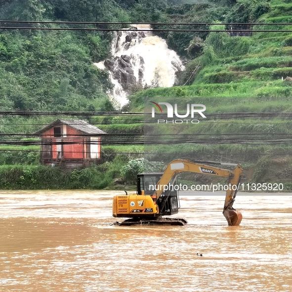 The flood damage is occurring in Gaozhai village, Qiandongnan County, Guizhou province, China, on the morning of June 12, 2024. 