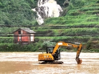 The flood damage is occurring in Gaozhai village, Qiandongnan County, Guizhou province, China, on the morning of June 12, 2024. (