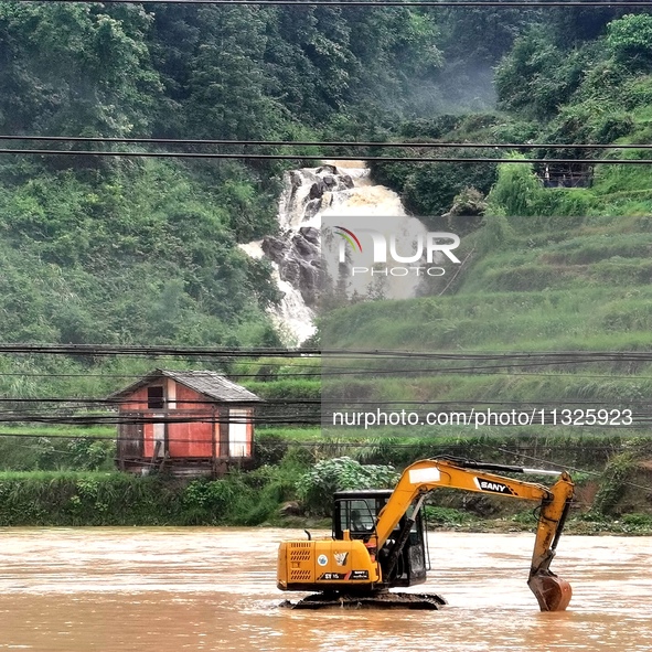 The flood damage is occurring in Gaozhai village, Qiandongnan County, Guizhou province, China, on the morning of June 12, 2024. 