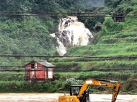 The flood damage is occurring in Gaozhai village, Qiandongnan County, Guizhou province, China, on the morning of June 12, 2024. (