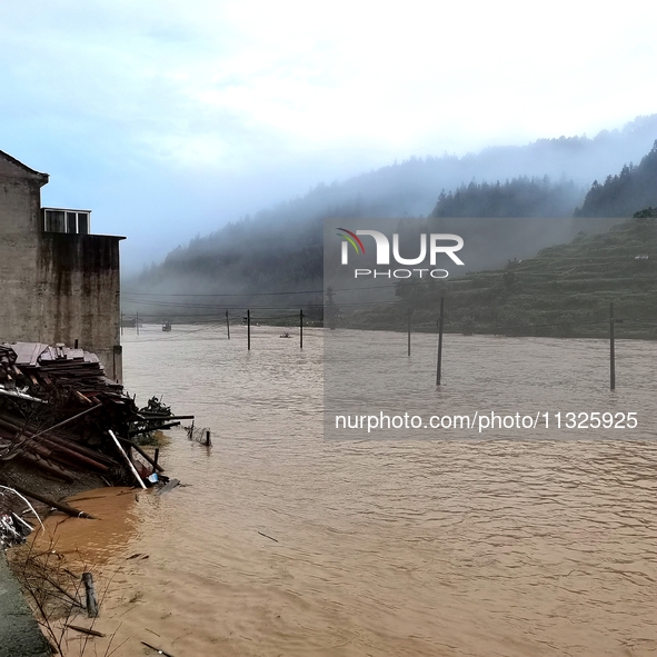 The flood damage is occurring in Gaozhai village, Qiandongnan County, Guizhou province, China, on the morning of June 12, 2024. 