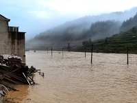 The flood damage is occurring in Gaozhai village, Qiandongnan County, Guizhou province, China, on the morning of June 12, 2024. (