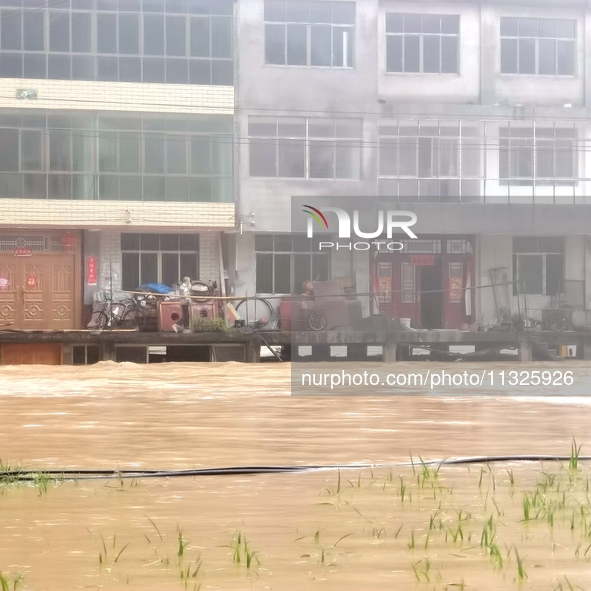 The flood damage is occurring in Gaozhai village, Qiandongnan County, Guizhou province, China, on the morning of June 12, 2024. 