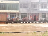 The flood damage is occurring in Gaozhai village, Qiandongnan County, Guizhou province, China, on the morning of June 12, 2024. (