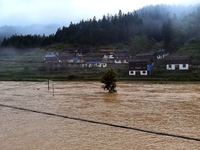 The flood damage is occurring in Gaozhai village, Qiandongnan County, Guizhou province, China, on the morning of June 12, 2024. (