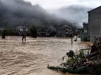 The flood damage is occurring in Gaozhai village, Qiandongnan County, Guizhou province, China, on the morning of June 12, 2024. (