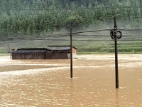 The flood damage is occurring in Gaozhai village, Qiandongnan County, Guizhou province, China, on the morning of June 12, 2024. (