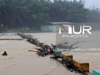 The Datantun Bridge is flooding in Liuzhou, China, on June 13, 2024. (