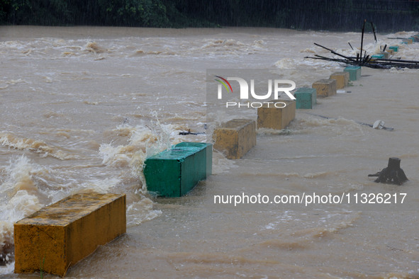 The Datantun Bridge is flooding in Liuzhou, China, on June 13, 2024. 