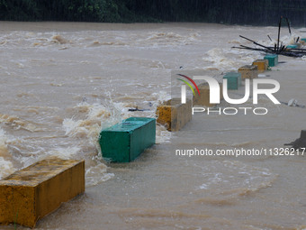 The Datantun Bridge is flooding in Liuzhou, China, on June 13, 2024. (