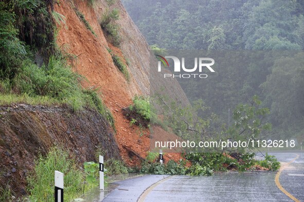 A slope is collapsing at the Sanmatun road section in Liuzhou City, Guangxi Province, China, on June 13, 2024. 