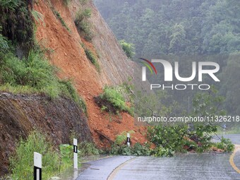 A slope is collapsing at the Sanmatun road section in Liuzhou City, Guangxi Province, China, on June 13, 2024. (