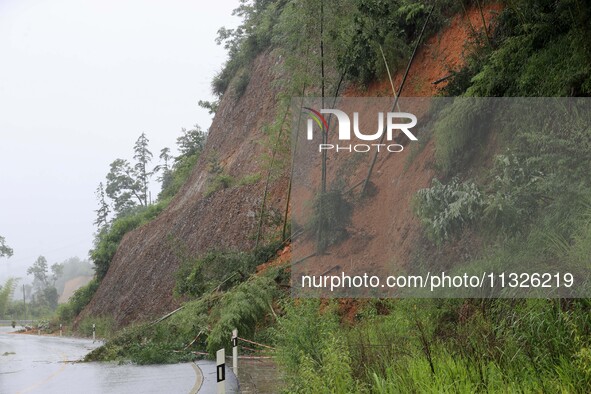 A slope is collapsing at the Sanmatun road section in Liuzhou City, Guangxi Province, China, on June 13, 2024. 