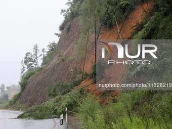 A slope is collapsing at the Sanmatun road section in Liuzhou City, Guangxi Province, China, on June 13, 2024. (