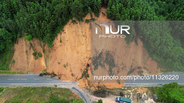 Traffic is temporarily suspending after a slope collapses at Sanmatun Road in Liuzhou, China, on June 13, 2024. 