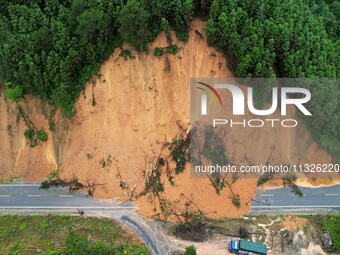 Traffic is temporarily suspending after a slope collapses at Sanmatun Road in Liuzhou, China, on June 13, 2024. (