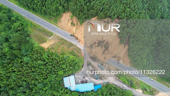 Traffic is temporarily suspending after a slope collapses at Sanmatun Road in Liuzhou, China, on June 13, 2024. 