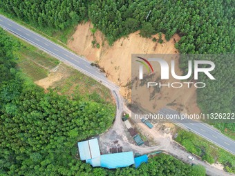 Traffic is temporarily suspending after a slope collapses at Sanmatun Road in Liuzhou, China, on June 13, 2024. (