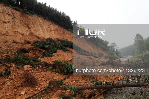 A slope is collapsing at the Sanmatun road section in Liuzhou City, Guangxi Province, China, on June 13, 2024. 